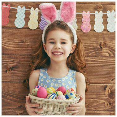 Little girl with colorful Easter eggs