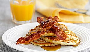 Banana pancakes with crispy bacon & syrup