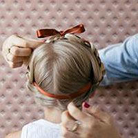Heidi braid with a bow hairstyle