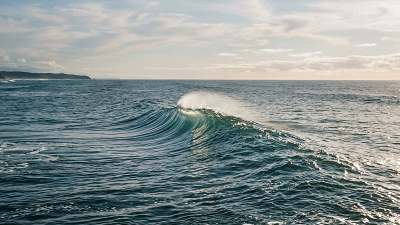 Ocean and wave analogy illustrating unity of Atman and Brahman in Upanishads philosophy