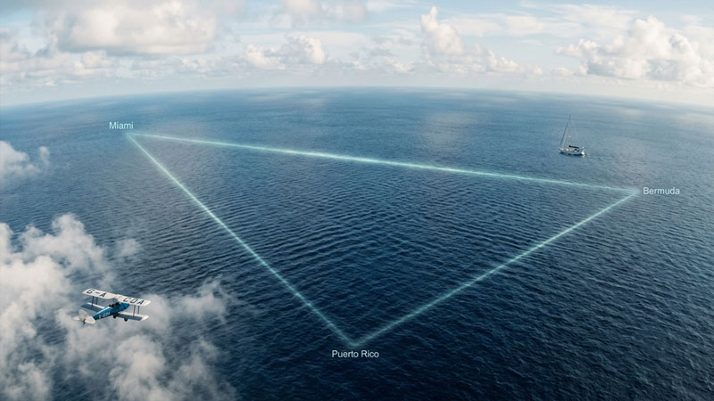 Aerial illustration of the Bermuda Triangle with a plane and ship over open ocean